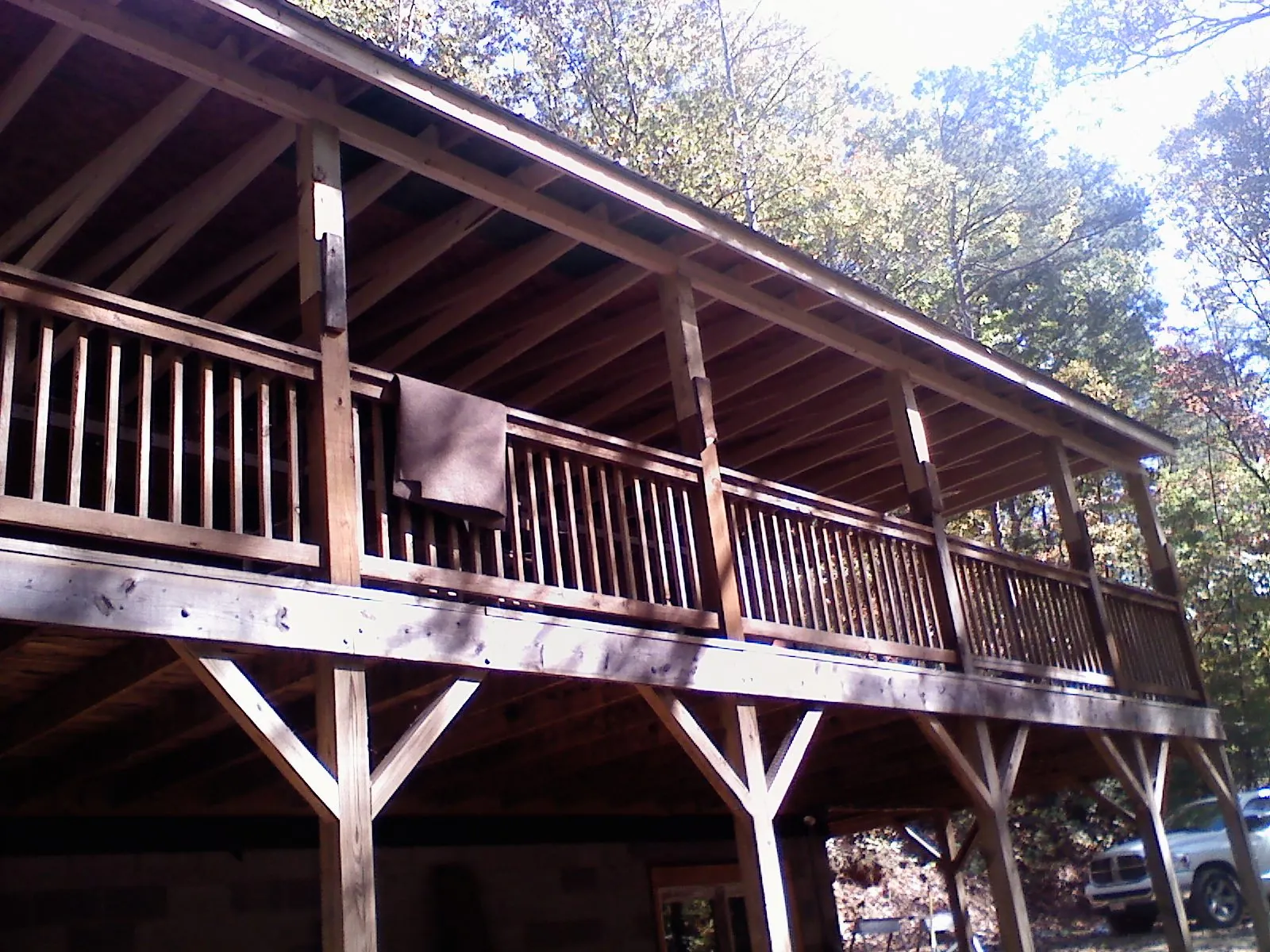 Timber framing under a new elevated porch and deck in Alton
